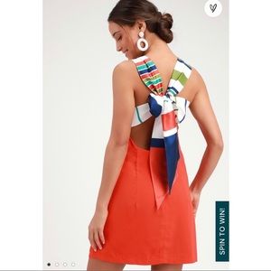 Orange dress with multi color striped tie-back